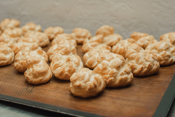 cream buns on a wooden table