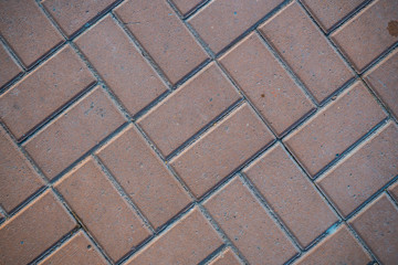 Texture of paving slabs overgrown with grass. Background image of a stratum stone