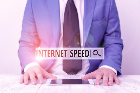 Text sign showing Internet Speed. Business photo showcasing the rate which internet connection is able to move or operate Businessman in blue suite with a tie holds lap top in hands - Powered by Adobe