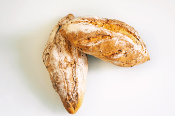 Fresh homemade bread with sunflower seeds, carrots isolated on a white background, cotton towel. Side view, top view, close-up view.
