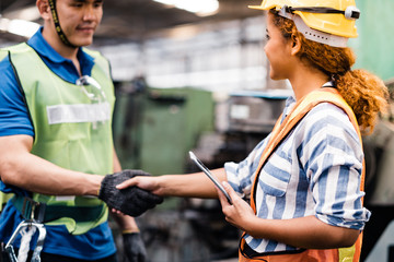 Industrial Engineers in Hard Hats.Work at the Heavy Industry Manufacturing Factory.industrial worker indoors in factory.Staff  working in an industrial factory.