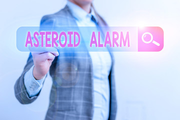 Conceptual hand writing showing Asteroid Alarm. Concept meaning warning to prepare the cities in a...