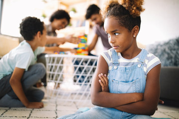 Little rebelious girl has conflict with family. Family problems. Social misbehaviour.
