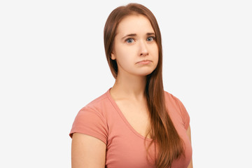 Obraz premium Emotionally wounded woman with sad expression on face, crooked lower lip with disgruntled look. Girl received bad words about work, feels disappointed. isolated on white background in Studio