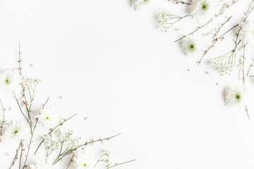 Flowers composition. White flowers on white background. Spring concept. Flat lay, top view, copy space
