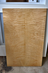 Sycamore maple cabinet door in workshop. High gloss cabinet door. Furniture manufacture