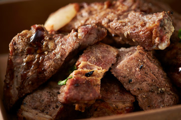 Take out beef steak in paper plate 