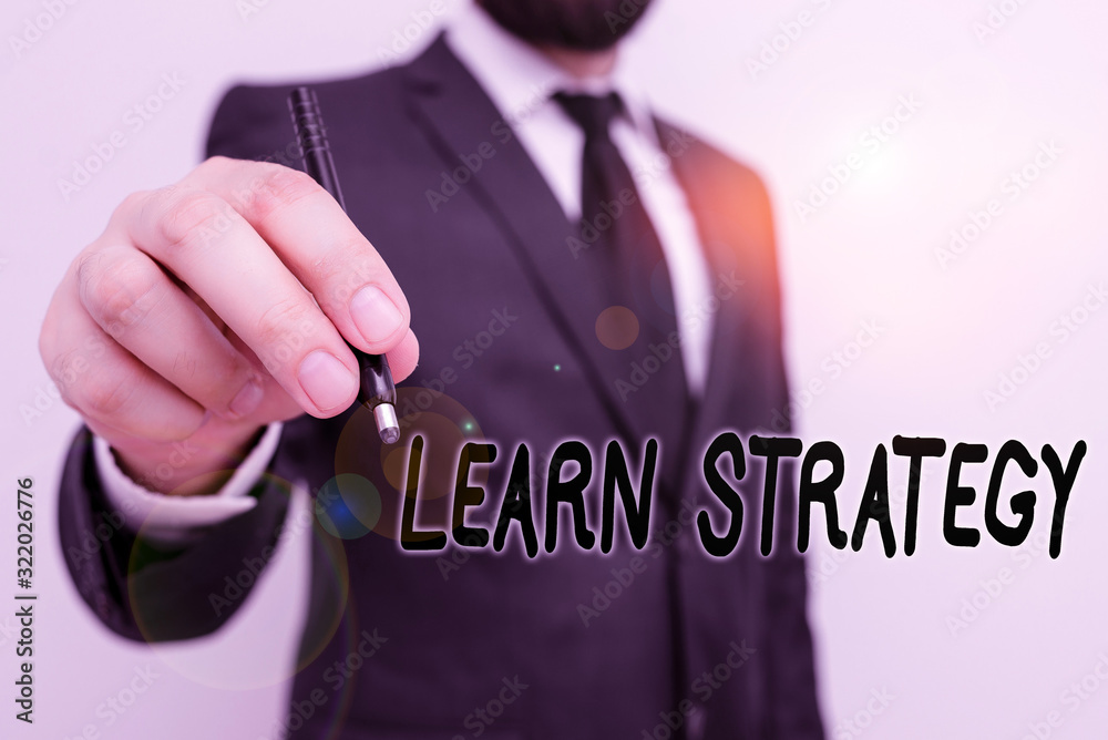 Poster Conceptual hand writing showing Learn Strategy. Concept meaning way of organizing and using set of skills in order to learn Male human with beard wear formal working suit clothes hand