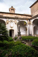 Obraz premium Padula, Salerno, Campania, Italy - May 21, 2017: Cloister of the ancient cemetery in the Certosa di San Lorenzo