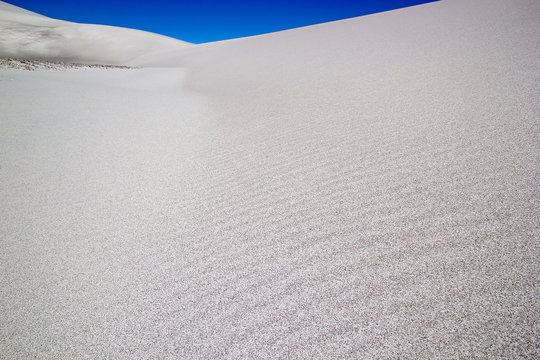 Sand of the white dune at the lava field of the volcano Caraci Pampa at the Puna de Atacama, Argentina