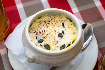 Pumpkin soup recipe in the white bowl for healthy food concept background