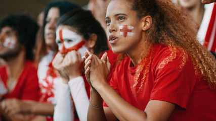 Group of English football team supporters in stadium - obrazy, fototapety, plakaty
