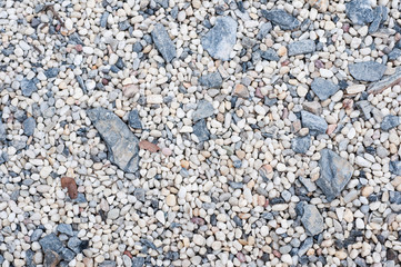 Small rock surface for background and texture, various size of rock on ground.