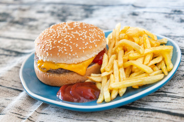 Cheese burger - American cheese burger with Golden French fries