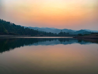 Fototapeta na wymiar majestic sunrise scene over lake