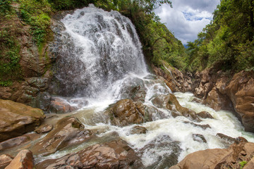 The village Cat Cat in Sapa, Vietnam. Large waterfall in the rainy season;