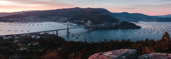 Panorama view of Rande bridge over estuary of Vigo at sunset, Galicia - obrazy, fototapety, plakaty