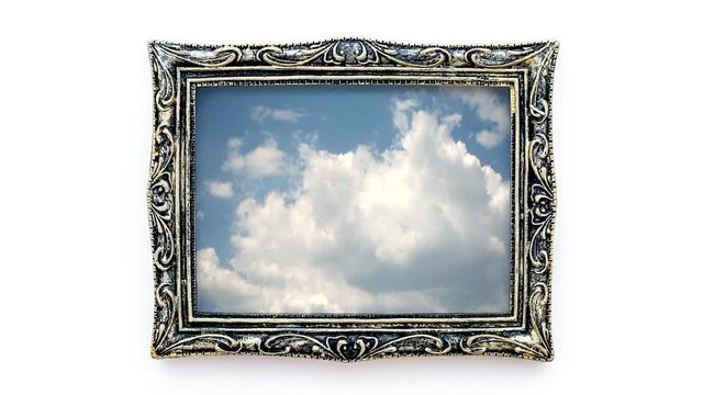 Creative 4k time laps video of moving clouds in a beautiful vintage picture frame. 3D effect of moving image in a static frame.