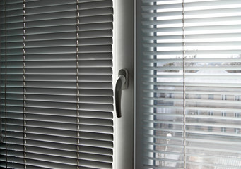 Office blinds. Modern iron shutters. Lighting control in the conference room.