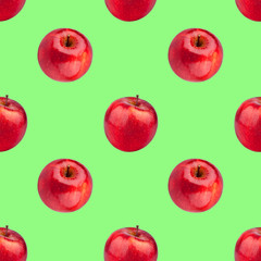 Seamless pattern of fresh red apples on green background isolated, bright shiny apple repeating ornament, tasty juicy ripe fruits backdrop, natural healthy diet food concept, colorful summer wallpaper