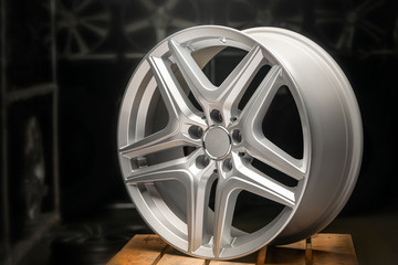alloy wheel silver, rim new car wheel on a black background