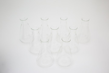 Group of scientific laboratory glass erlenmeyer flask isolated on white background