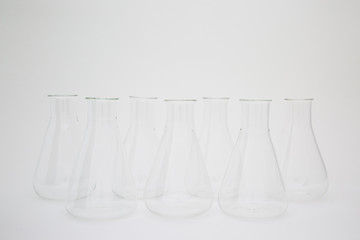 Group of scientific laboratory glass erlenmeyer flask isolated on white background