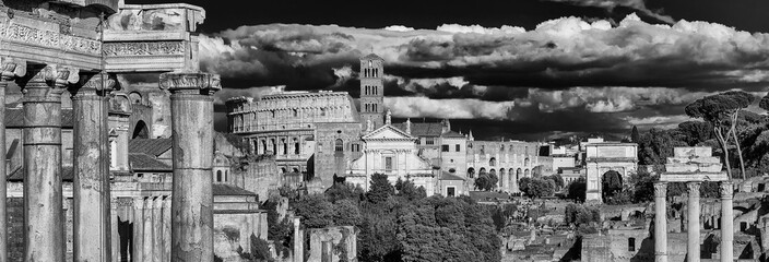 View of Roman Forum ancient ruins with Coliseum and baroque church