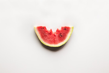 Fresh bitten watermelon slice isolated on white background