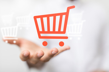 Businessman pressing modern technology panel shopping cart web phone credit card.