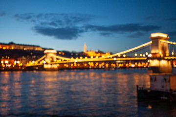Blurred Budapest chain bridge on danube river. Famous sights at landmark Buda riverbank.
