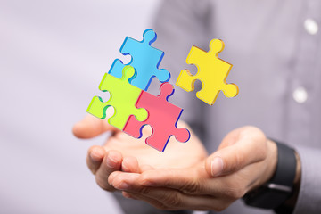 puzzle hand solution concept business.