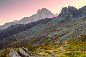 Hiking in the mountains in autumn. Early morning landscape view of the Alps, Chamonix-Mont-Blanc,...