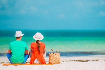 Young couple on white beach during summer vacation.