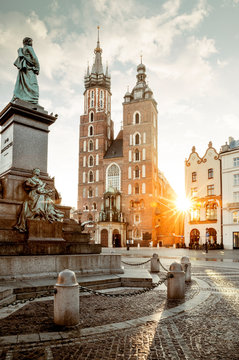 Naklejki Adam Mickiewicz monument and St. Mary's Basilica on Main Square in Krakow, Poland