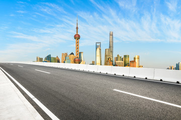 Fototapeta na wymiar Urban architecture landscape and empty asphalt road in Shanghai