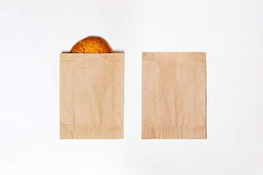 Brown Paper Bags with bread Mock up isolated on a white background.Top view.High resolution photo.