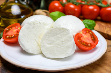 Cheese collection, white italian mozzarella cheese balls for salad or for appetizer snacks from deli shop in New York, USA