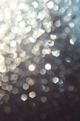 abstract backgrounf of glitter vintage lights . silver and white. 