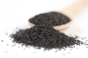 Basil seeds or Hairy,Sabja in wooden spoon isolated on white background. spices and food ingredients. spices and food ingredients