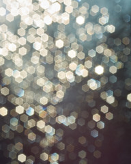 abstract backgrounf of glitter vintage lights . silver and white. 