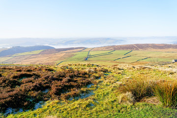 Over the hills and valleys of a fog shrouded Derbyshire countryside
