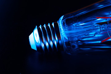Light bulb on black background close up