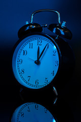 Alarm clock close up on black background