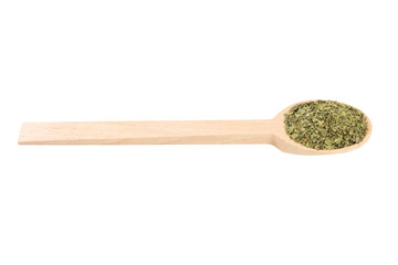 dried lovage herb in wooden spoon isolated on white background. spices and food ingredients. spices and food ingredients