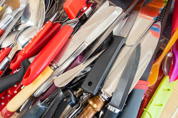 Close up view of kitchen knives and other cutlery