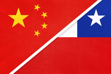 China or PRC vs Chile national flag from textile. Relationship between asian and american countries.