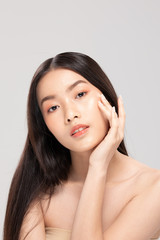 Fototapeta premium Beautiful Asian young woman touching soft cheek smile with clean and fresh skin Happiness and cheerful with positive emotional,isolated on white background,Beauty and Cosmetics Concept