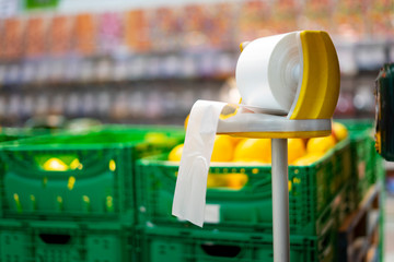 Plastic bag dealer in a supermarket fruit shop.
