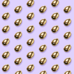 Card for Happy Easter celebrating or greeting. Golden colored eggs on purple background. Modern artwork, bright wallpaper, background, pattern for your device, design or advertisement. concept.
